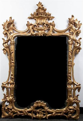 A George III Style Gilt and Gesso Mirror, Height 56 1/8 x width 38 inches.