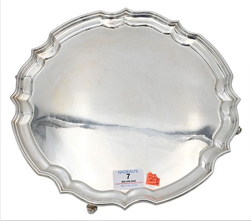 Silver Salver, on scrolled feet, diameter 12 inches, 23.2 t.oz. Provenance: Collections of Norma Reilly, New Jersey.