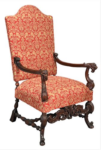 Walnut Occasional Armchair, having carved lion handrests with custom upholstered seat and back with peacocks, on carved base, height 50 inches, width 