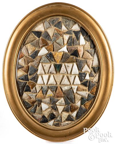 Framed collection of triangular stone points