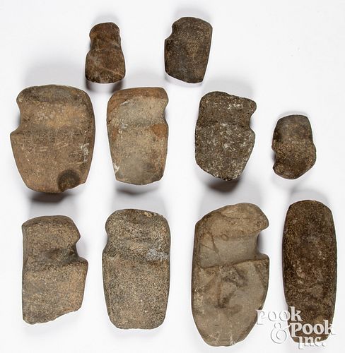 Ten 3/4 groove stone axe heads of various sizes