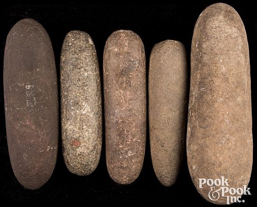 Five prehistoric stone pestles