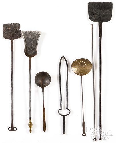 Group of wrought iron fireplace tools and utensils