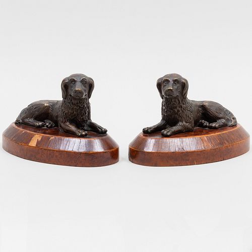 Pair of Cast Metal Recumbent Dogs on Inlaid Wood Bases