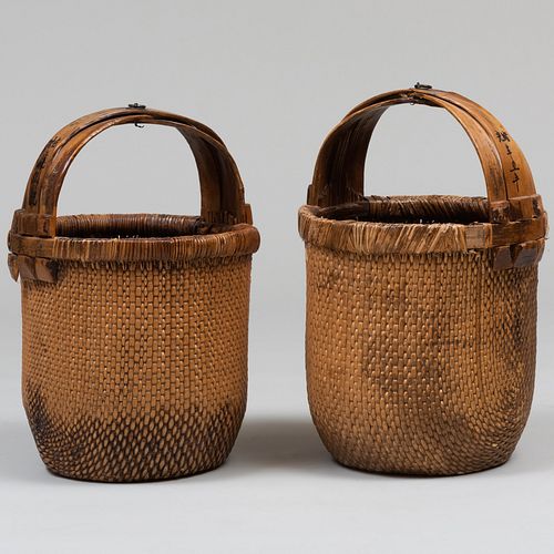 Two Asian Woven Baskets with Wooden Handles