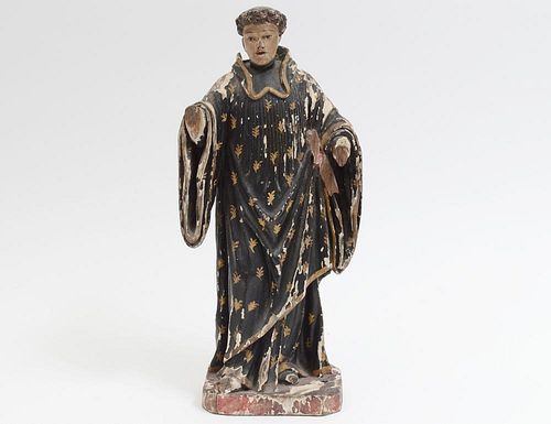 CARVED AND POLYCHROMED FIGURE OF A SAINT
