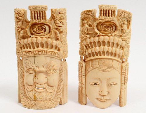 PAIR OF CARVED IVORY MASKS
