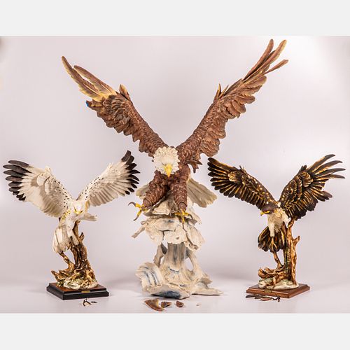 A Group of Three Porcelain Statues of Birds of Prey