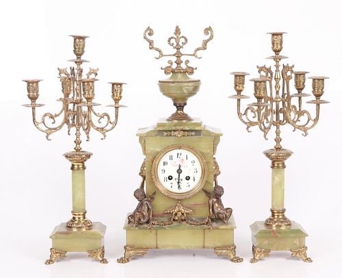 A French Brass & Onyx Clock Garniture