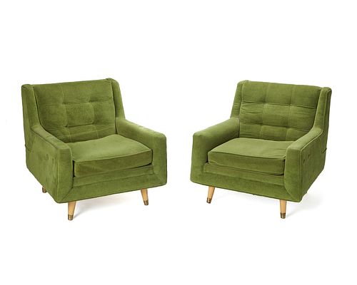 A pair of modern green club chairs