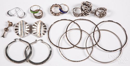 Group of mostly silver jewelry.