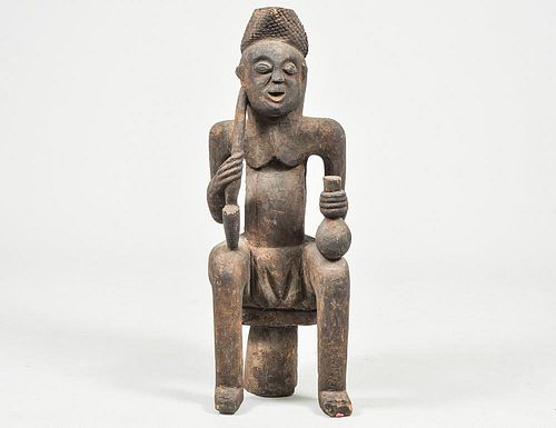 AFRICAN TRIBAL FIGURE OF A SEATED MAN