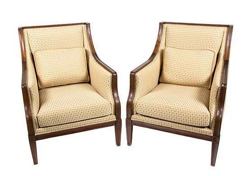 A Pair of Louis XVI Style Carved Walnut and Upholstered Bergeres Height 37 inches.