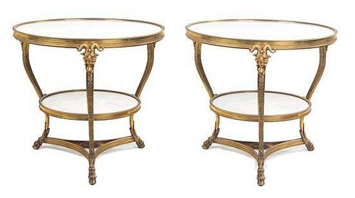 A Pair of Neoclassical Style Marble and Bronze Tables Height 27 1/2 x diameter 30 1/2 inches.