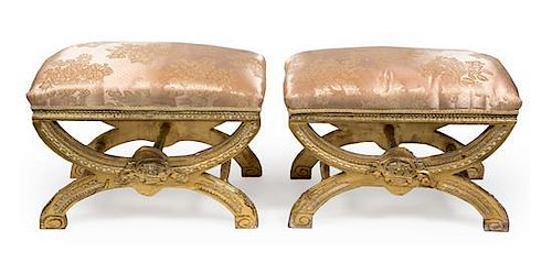 A Pair of Italian Carved Parcel Gilt Curule Stools Height 20 inches.