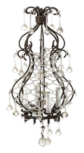 A Continental Gilt Metal Cage Form Four-Light Chandelier Height 25 x diameter 12 inches.