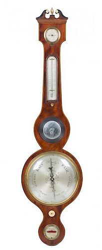 An English Mahogany Wheel Barometer Height 38 inches.