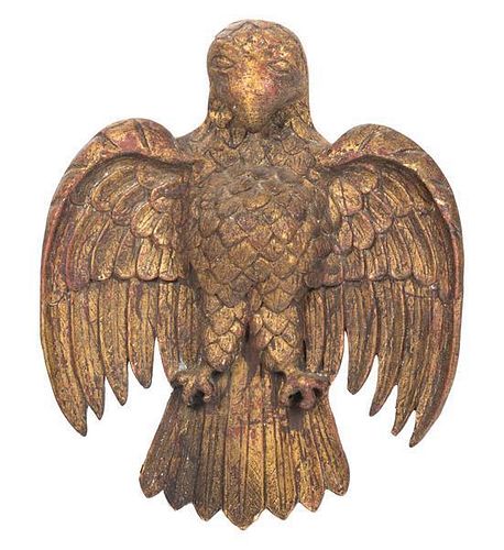 A Pair of Carved Giltwood Eagle Wall Ornaments Height 21 1/2 x width 17 1/4 inches.