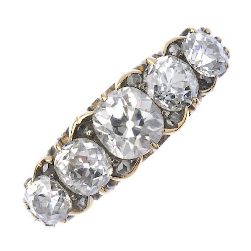 An early 20th century 18ct gold diamond five-stone ring. The old-cut diamond graduated line, with di