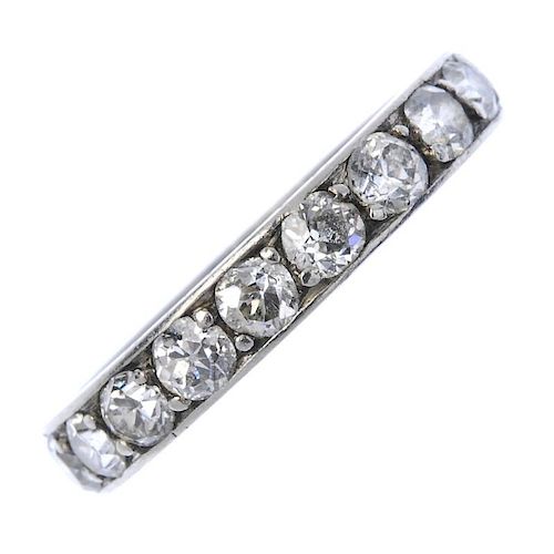 An early 20th century diamond full-circle eternity ring. The old-cut diamond line, to the engraved s