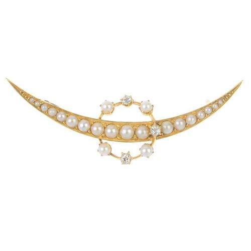 An early 20th century 18ct gold diamond and split pearl crescent brooch. Designed as a graduated spl