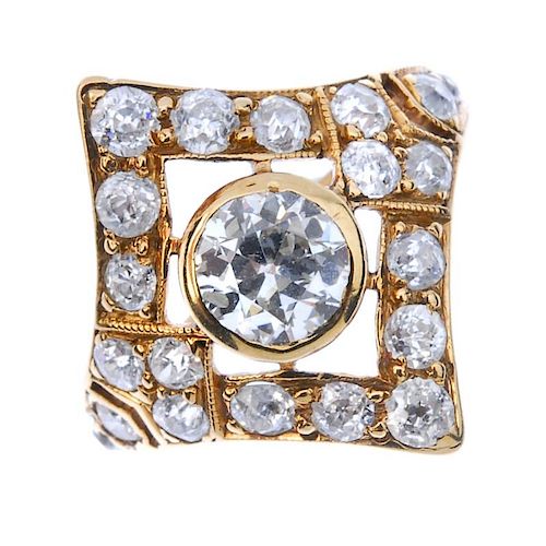 A diamond cluster ring. The old-cut diamond collet, within a similarly-cut diamond lozenge-shape sur