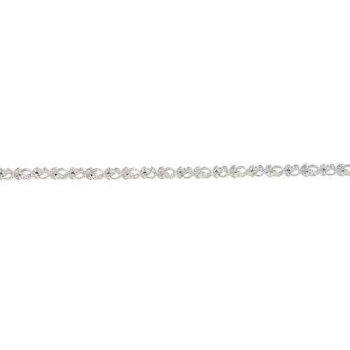 An 18ct gold diamond bracelet. Of repeating scrolling foliate design, set throughout with brilliant-