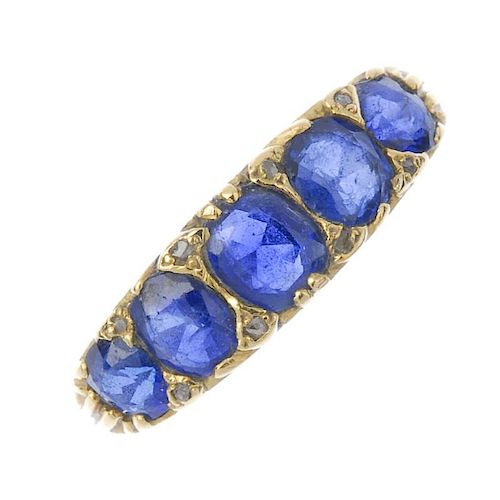 A sapphire and diamond five-stone ring. The vari-shape sapphire graduated line, with diamond point d