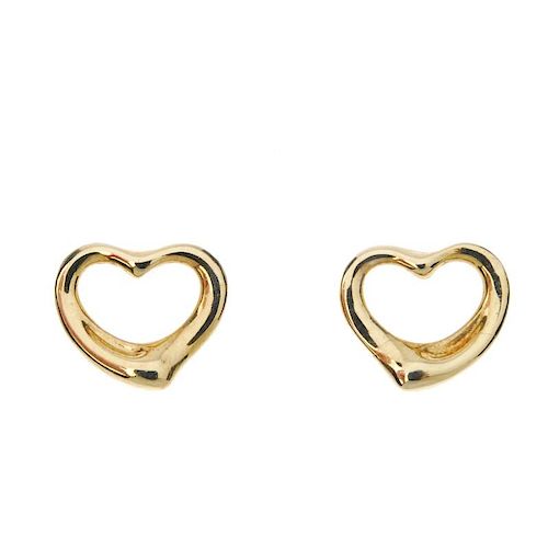 TIFFANY & CO. - a pair of 18ct gold 'open heart' earrings by Elsa Peretti for Tiffany & Co. Each des