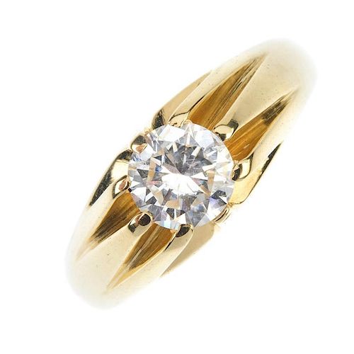 A gentleman's 18ct gold diamond single-stone ring. The brilliant-cut diamond, to the grooved sides a