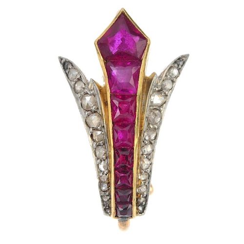 An early 20th century ruby and diamond surmount. The tapered vari-shape ruby line, with rose-cut dia