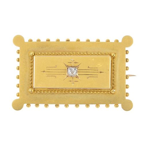 A late 19th century gold diamond brooch. Of rectangular outline, the old-cut diamond, inset to the g