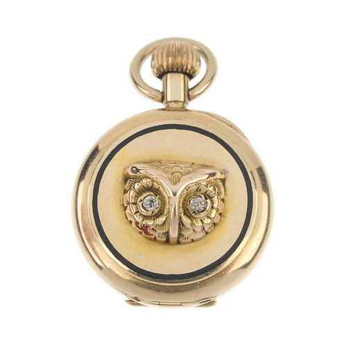 An early 20th century 15ct gold owl fob watch. The raised owl head with old-cut diamond eyes, within