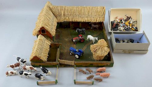 1920's model of farm yard with a small collection of Britains animals and other modern animals,