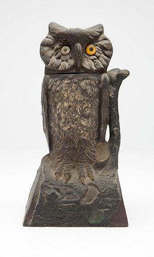 A painted cast-iron owl-form mechanical bank