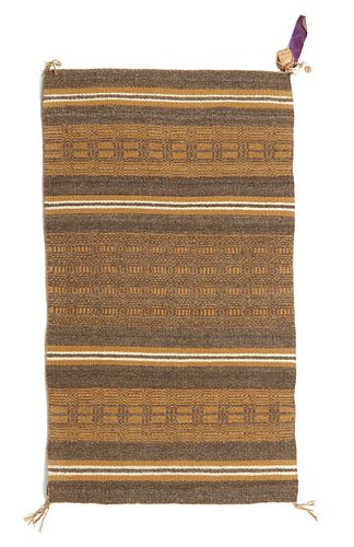 A Navajo Wide Ruins saddle blanket by Ruth Tsosie