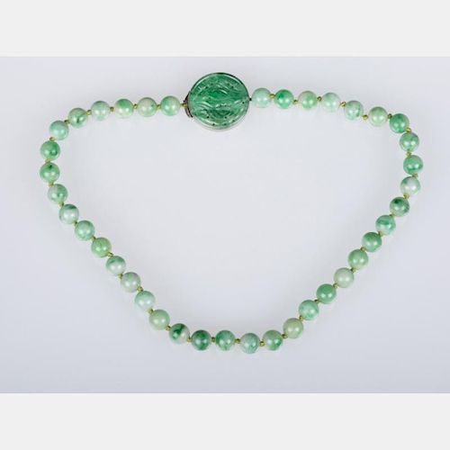 A Green Jade Beaded Necklace and Pendant,