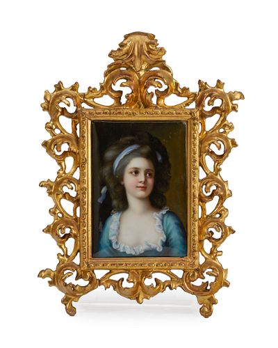 A framed porcelain portrait plaque