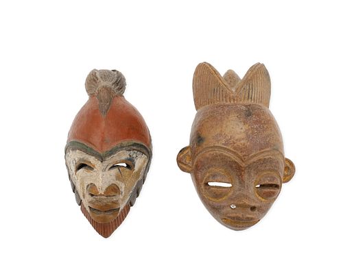 Two African earthenware currency masks