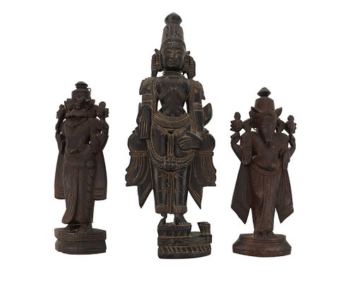 A South Indian carved wood figure of Vishnu and two avatars