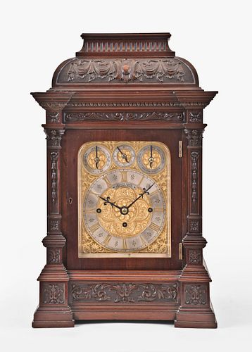 A large mahogany bracket clock chiming on gongs and bells by Elliott