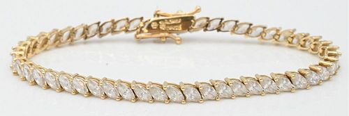 14 Karat Yellow Gold and Diamond Inline Bracelet, set wtih 51 marquis diamonds, approximately 2.4mm x 4.9mm each, length 6 1/2 inches, 8.9 grams.