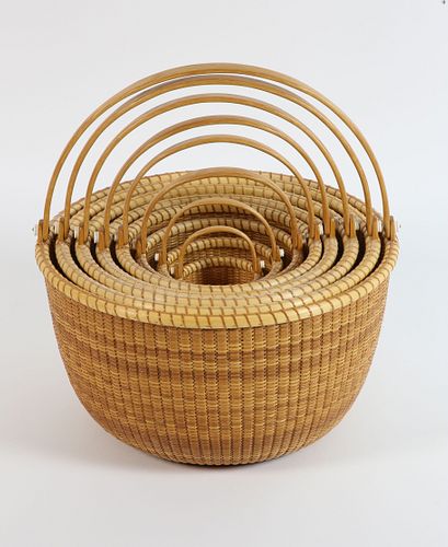 Nest of Eight Bill and Judy Sayle Round Nantucket Swing Handle Baskets, circa 1998