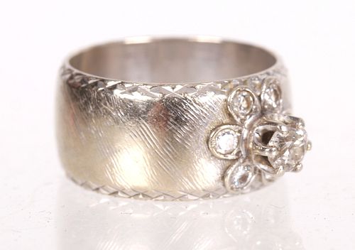 A 14k White Gold and Diamond Ring