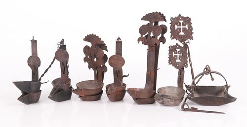 A Group Of Wrought Iron Betty Lamps