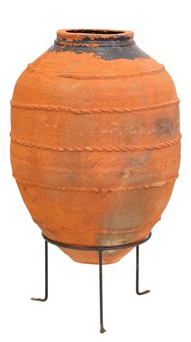 LARGE BANDED TERRACOTTA OLIVE JAR IN IRON STAND