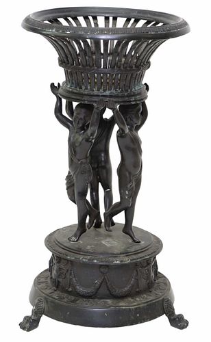 LARGE PATINATED BRONZE BASKET WITH PUTTO PLANTER