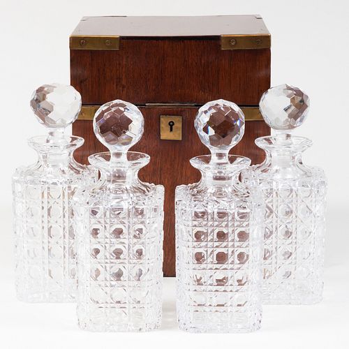 English Brass-Mounted Mahogany Tantalus with Four Cut Glass Bottles