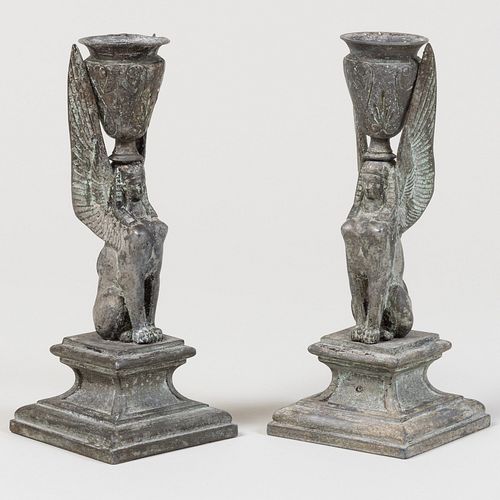 Pair of Patinated Metal Sphinx Form Candlesticks