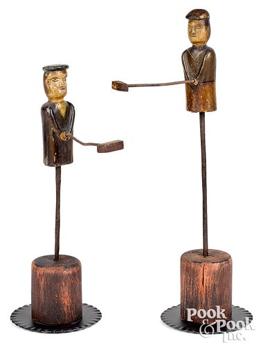 Pair of carved figural clock bell chimers, 19th c.